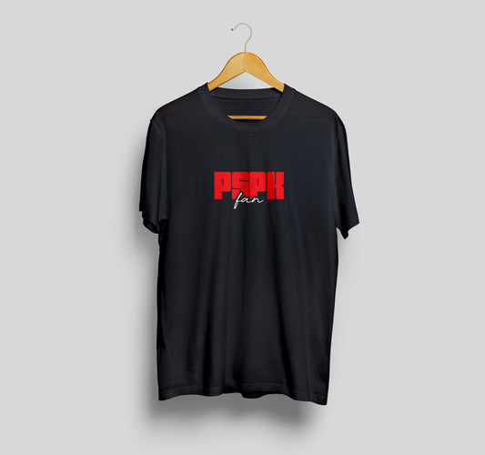 Black t-shirt with red and white text on a hanger against a gray background